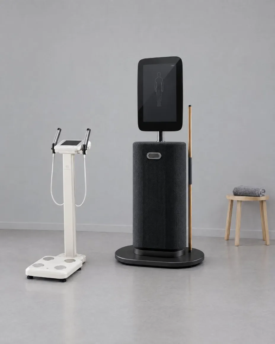 An InBody body composition analyser beside the EGYM Fitness Hub in a light-grey assessment room.